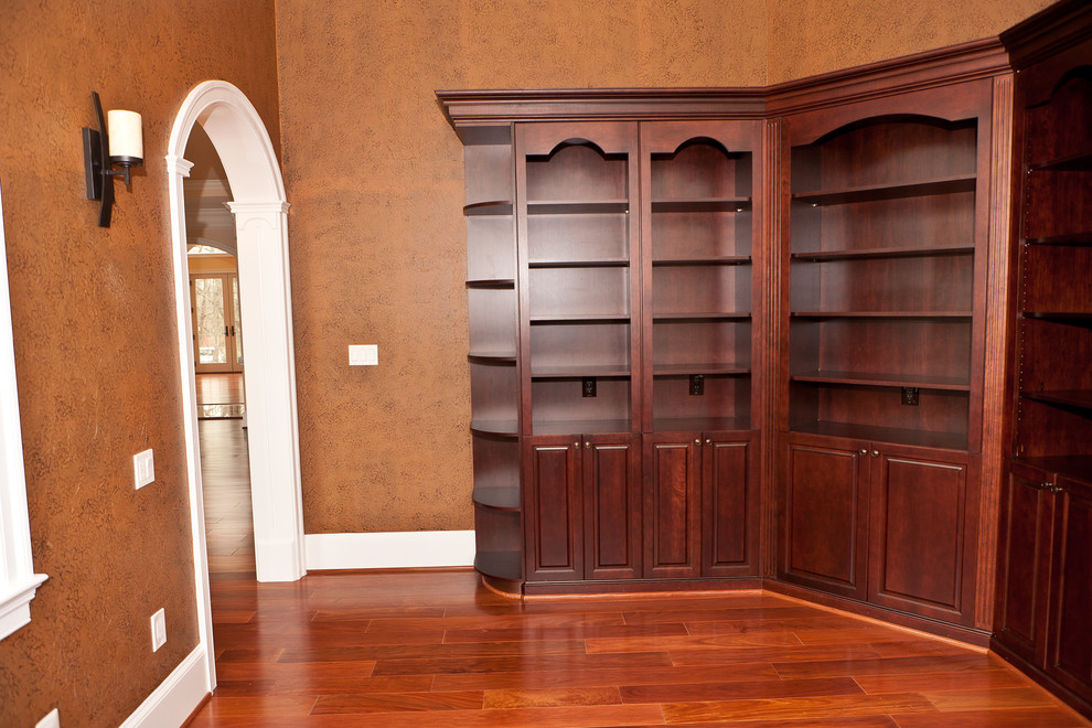 Design ideas for a large transitional home office in DC Metro with medium hardwood floors.