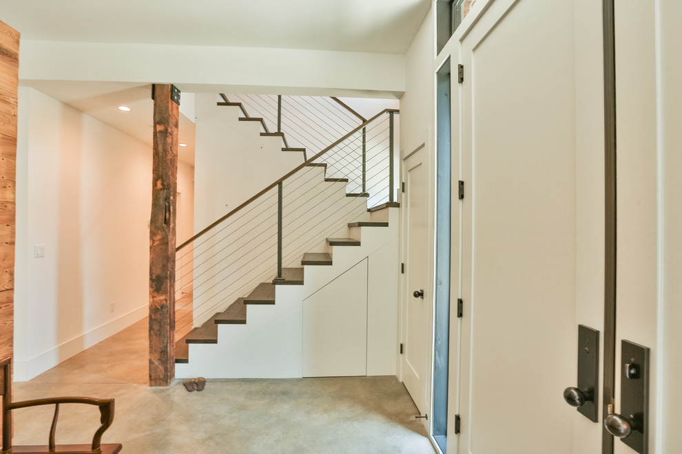 Photo of a mid-sized contemporary wood floating staircase in Boston with painted wood risers.