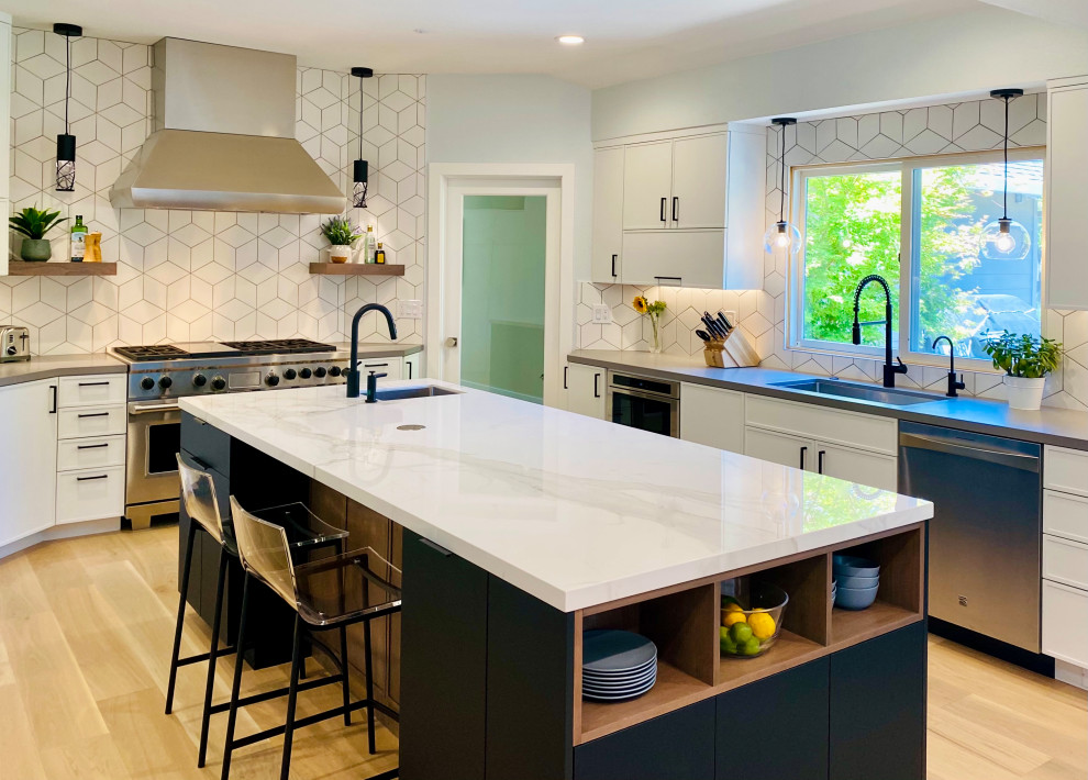 Inspiration for a large contemporary open plan kitchen in San Francisco with recessed-panel cabinets, white cabinets, white splashback and with island.