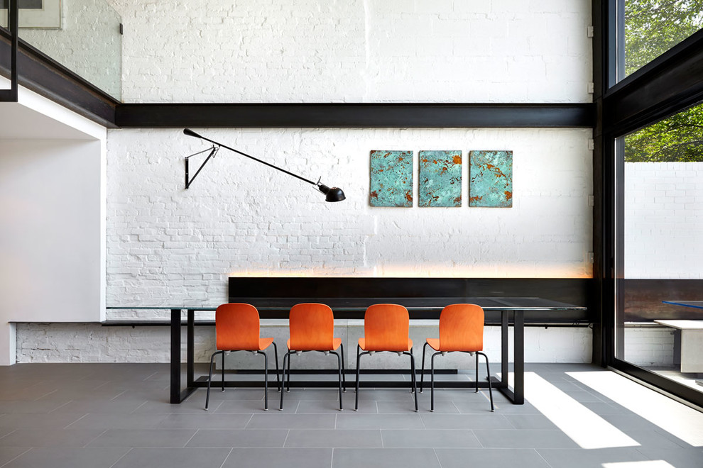 Photo of a contemporary dining room in DC Metro with white walls.