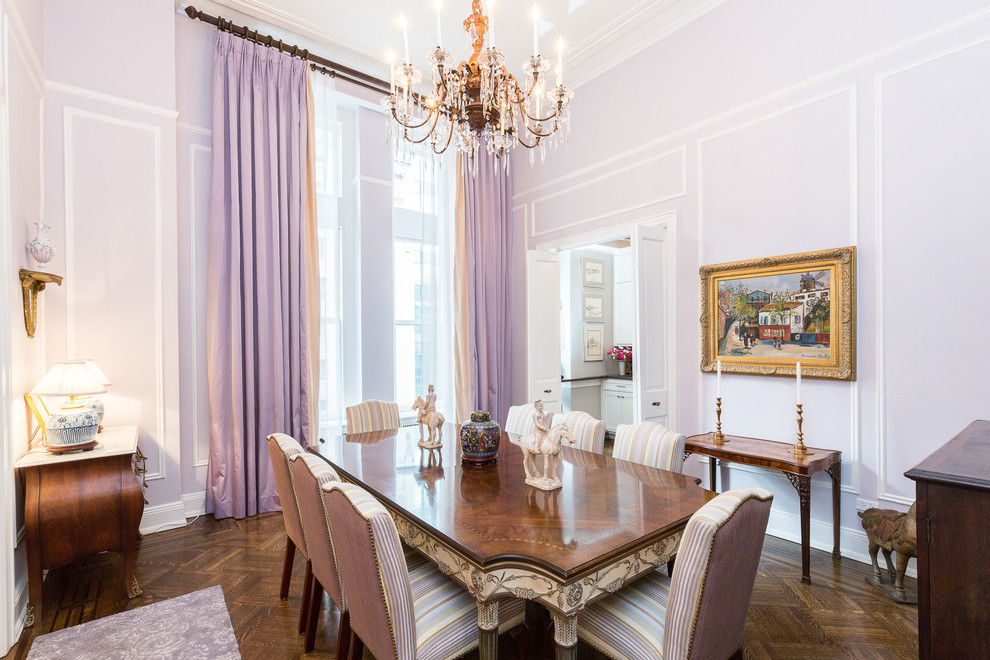 Large traditional separate dining room in New York with purple walls, dark hardwood floors and no fireplace.