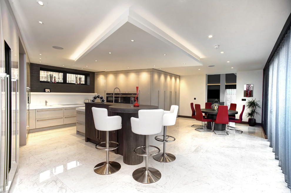Inspiration for an expansive contemporary u-shaped eat-in kitchen in Other with with island.