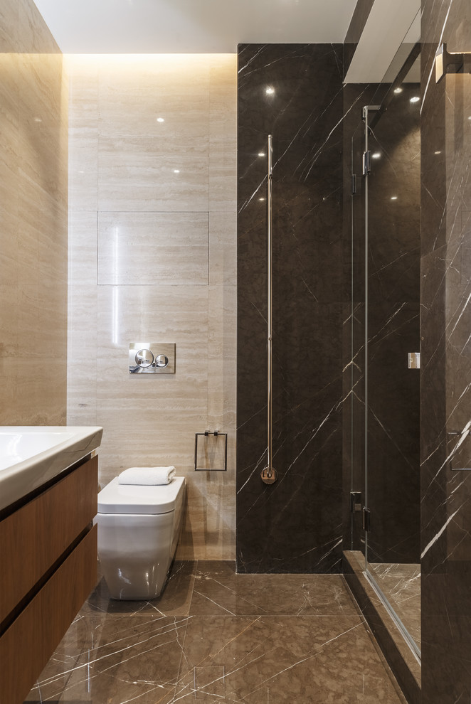 Inspiration for a large contemporary 3/4 bathroom in Moscow with flat-panel cabinets, medium wood cabinets, an alcove shower, a wall-mount toilet, beige tile, travertine, beige walls, marble floors, a drop-in sink, grey floor and a hinged shower door.
