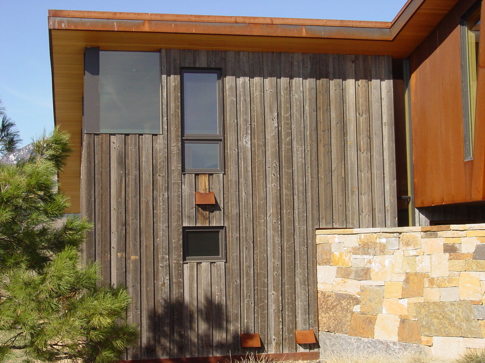 Photo of a large modern two-storey grey house exterior in Denver with mixed siding and a flat roof.