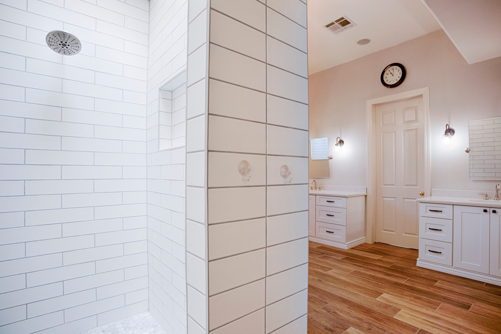 Example of a huge transitional master brown tile and porcelain tile porcelain tile freestanding bathtub design in Phoenix with shaker cabinets, white cabinets, a two-piece toilet, gray walls, an undermount sink and quartzite countertops