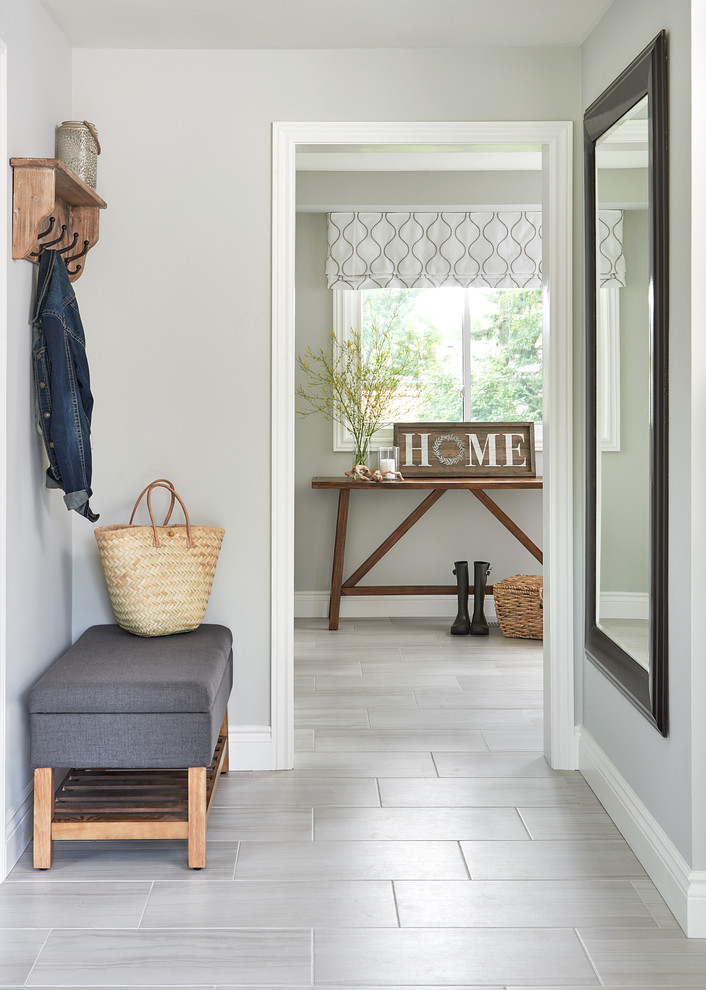 Design ideas for a transitional hallway in Other with grey walls, porcelain floors and grey floor.
