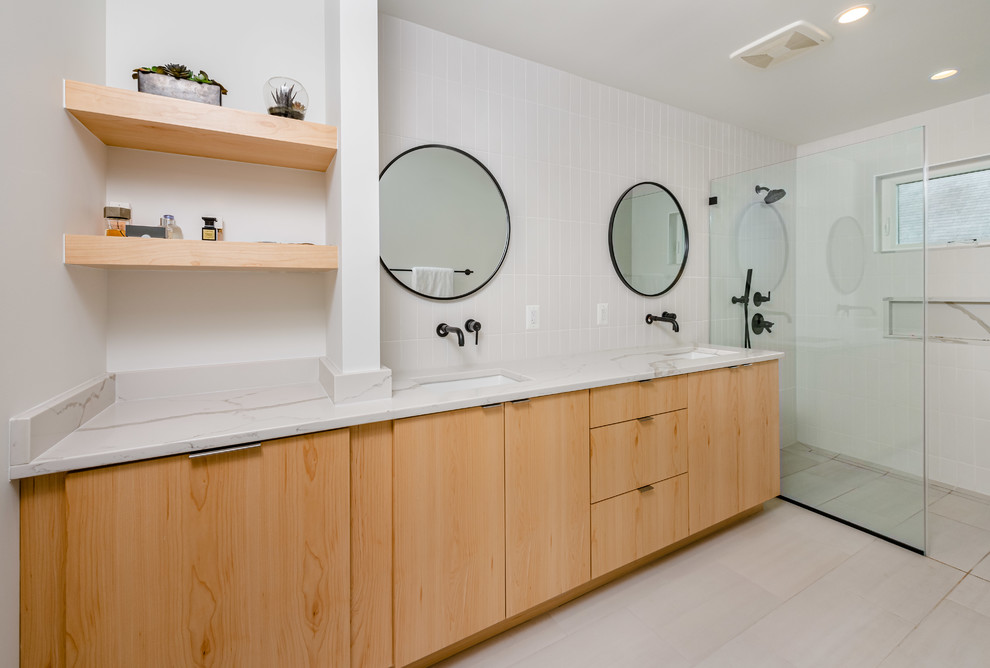Design ideas for a contemporary bathroom in DC Metro with flat-panel cabinets, light wood cabinets, a curbless shower, white tile, white walls, an undermount sink, beige floor, an open shower and white benchtops.