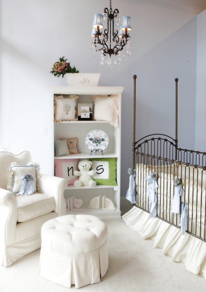 This is an example of a traditional gender-neutral nursery in Miami with purple walls and carpet.