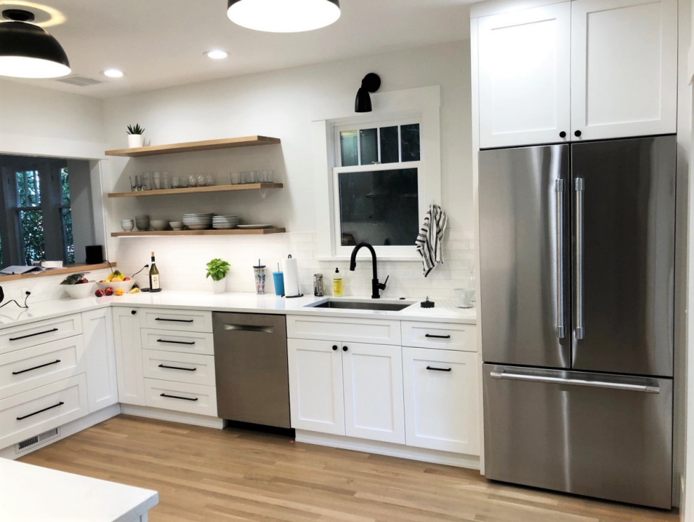 Kitchen - mid-sized transitional u-shaped kitchen idea in Seattle with shaker cabinets, white cabinets, quartz countertops and white countertops