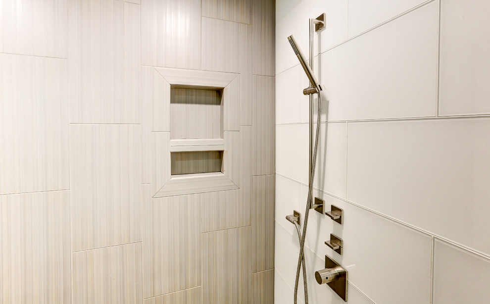 This is an example of a large contemporary master bathroom in Other with flat-panel cabinets, white cabinets, a corner tub, an open shower, a two-piece toilet, white tile, glass tile, white walls, a trough sink, quartzite benchtops and porcelain floors.