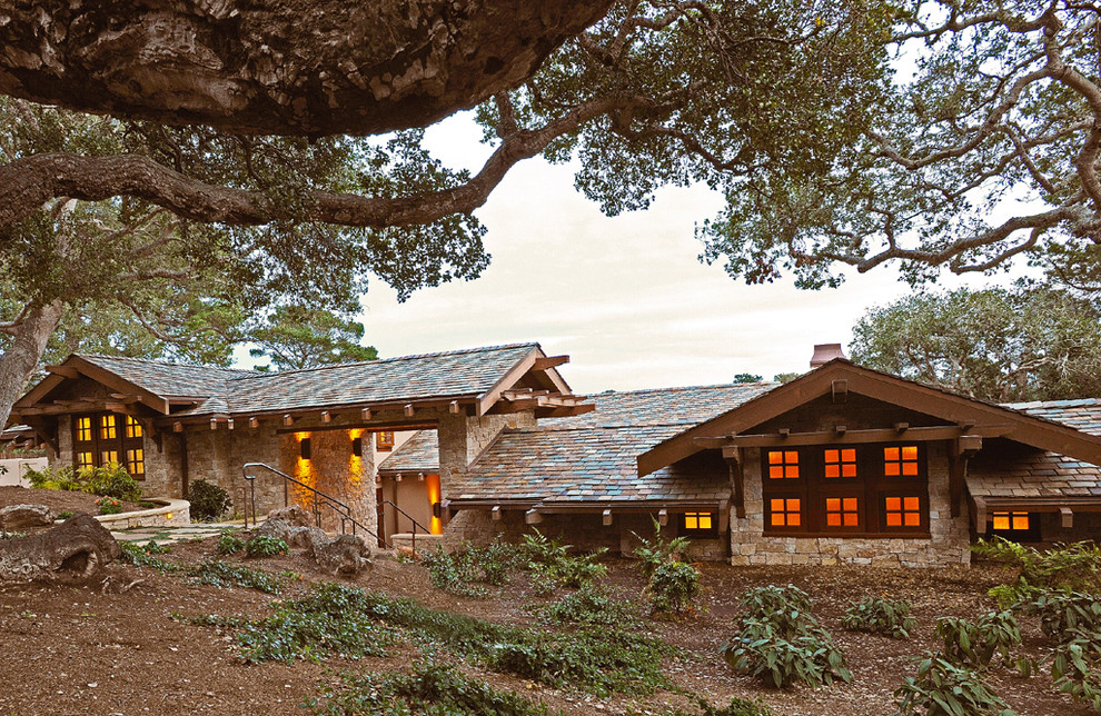Inspiration for a mid-sized arts and crafts two-storey brown exterior in San Francisco with stone veneer and a hip roof.
