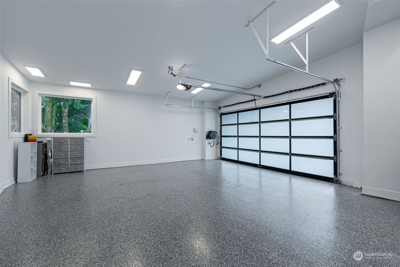 This contemporary custom home was designed to emphasize clean architectural lines, expansive natural light, and a strong connection between the indoor and outdoor living spaces. Large floor-to-ceiling