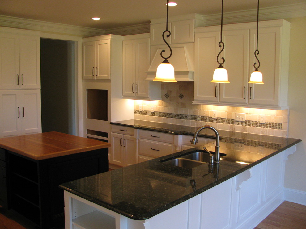 Example of a transitional kitchen design in Raleigh