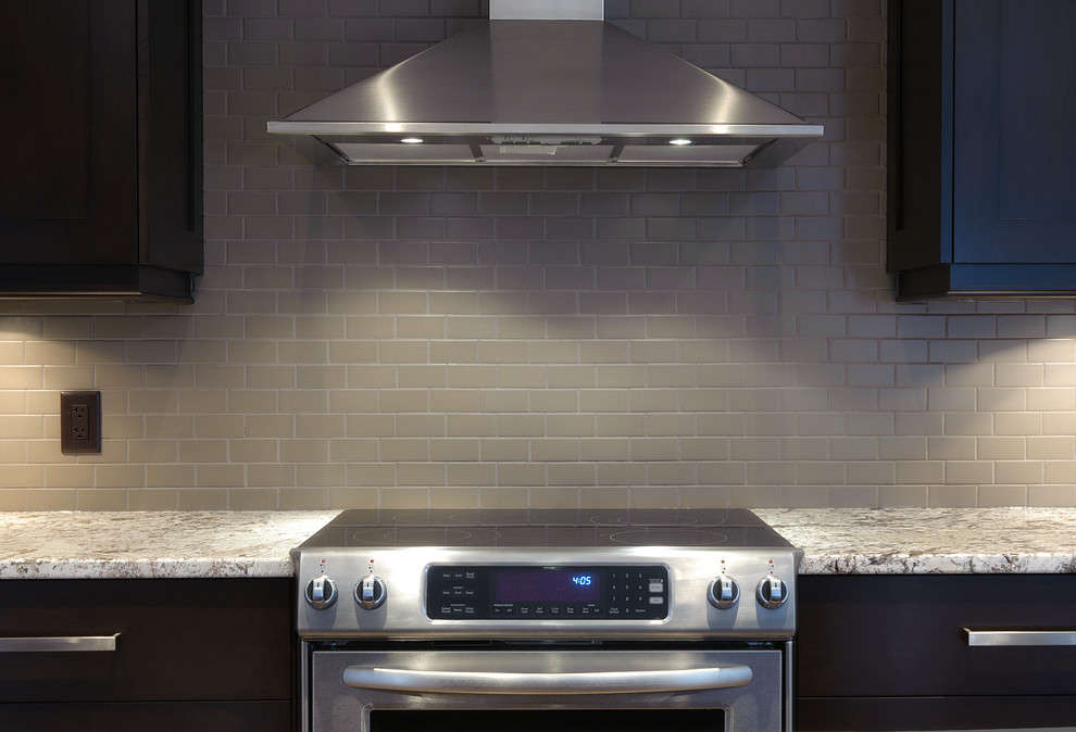Example of a transitional kitchen design in Calgary