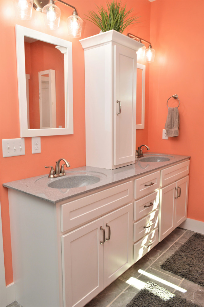 Photo of a large country master bathroom in Other with shaker cabinets, white cabinets, an open shower, pink walls, ceramic floors, an integrated sink, marble benchtops, grey floor, an open shower, grey benchtops, an enclosed toilet, a double vanity and a built-in vanity.