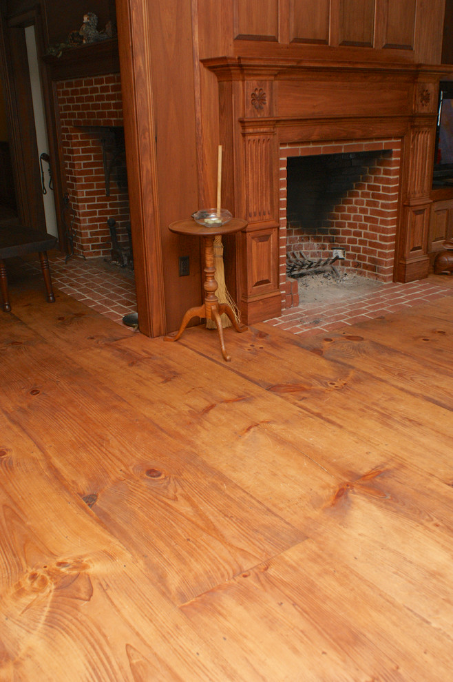 This is an example of a traditional living room in Providence with medium hardwood floors.