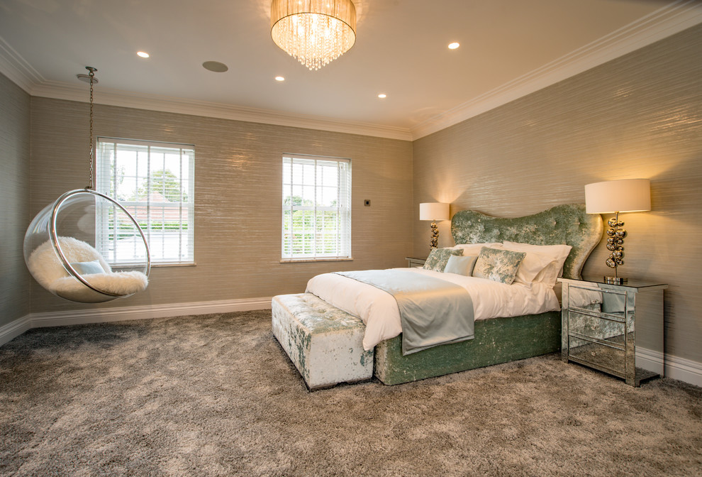 This is an example of a large contemporary bedroom in Buckinghamshire with beige walls, carpet and grey floor.