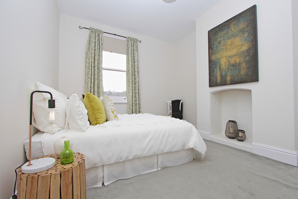 Inspiration for a transitional bedroom in Hobart with grey walls and carpet.