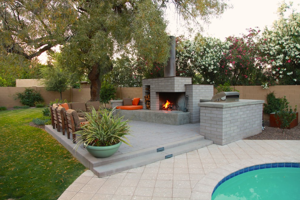 Photo of a mid-sized contemporary backyard patio in Phoenix with no cover.