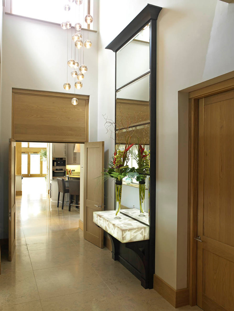 This is an example of a large contemporary hallway in Other with white walls.