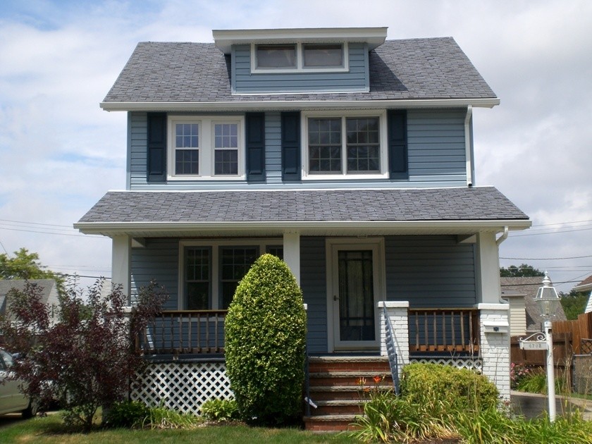 Small transitional two-storey blue exterior in Cleveland.