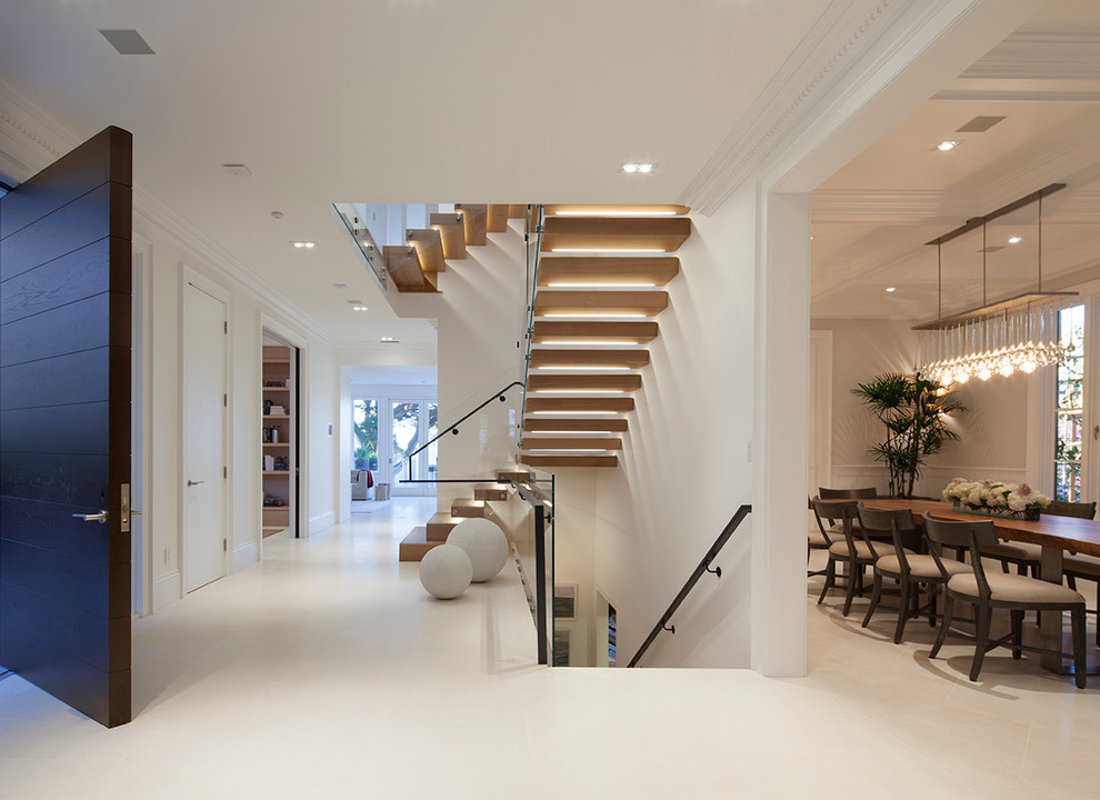 Modern wood floating staircase in San Francisco with wood risers.