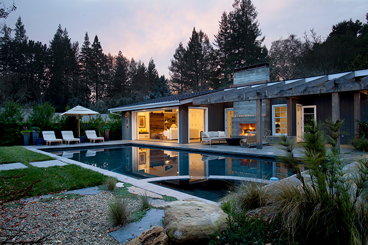 Inspiration for a mid-sized industrial backyard rectangular lap pool in San Francisco with a hot tub.