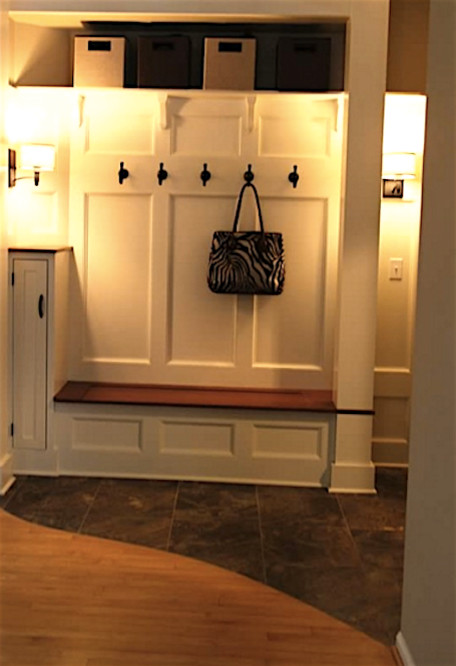 Inspiration for a mid-sized traditional hallway in New York with beige walls and slate floors.
