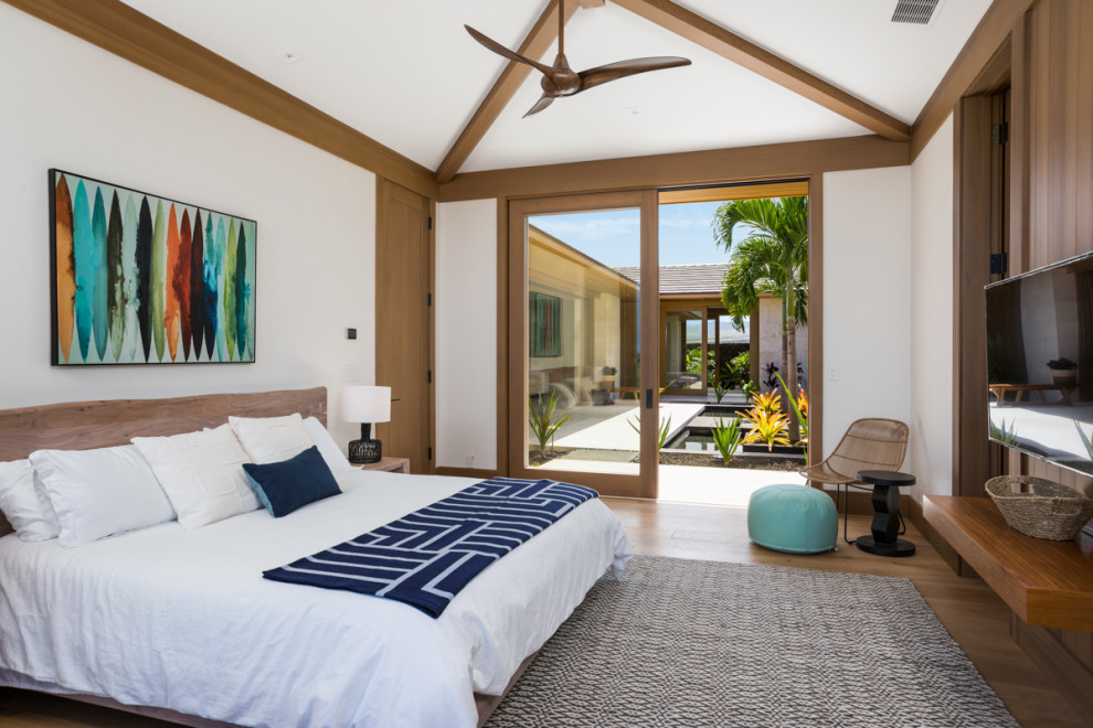 This is an example of a tropical bedroom in Other.