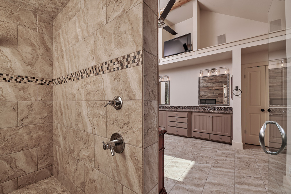 Inspiration for a large transitional master bathroom in Other with beaded inset cabinets, beige cabinets, a curbless shower, a two-piece toilet, beige tile, ceramic tile, beige walls, porcelain floors, an undermount sink, granite benchtops, beige floor, a hinged shower door and brown benchtops.