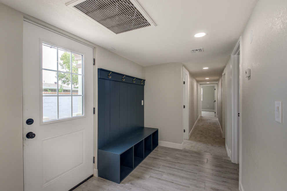 Example of a mid-sized transitional porcelain tile and gray floor entryway design in Phoenix