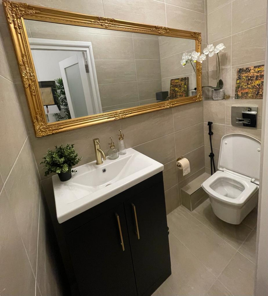 Mid-sized modern powder room in London with flat-panel cabinets, dark wood cabinets, a wall-mount toilet, beige tile, cement tile, beige walls, ceramic floors, a wall-mount sink, quartzite benchtops, beige floor, white benchtops, a floating vanity, recessed and brick walls.
