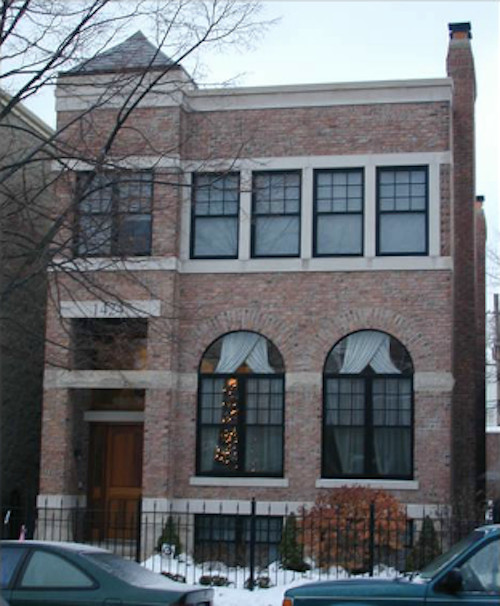 Photo of a mid-sized transitional three-storey brick brown apartment exterior in Chicago with a hip roof and a shingle roof.