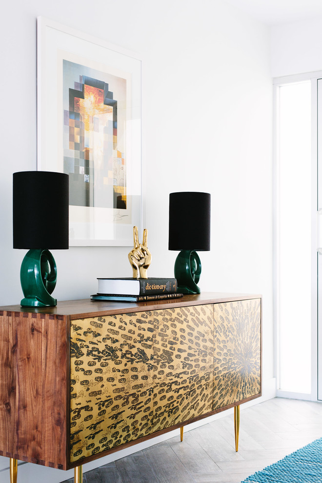 Inspiration for an eclectic entryway in Los Angeles with white walls.
