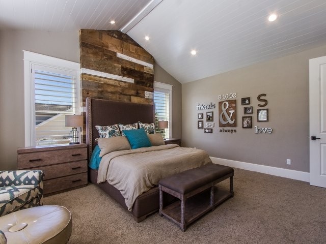 This is an example of a small transitional guest bedroom in Salt Lake City with grey walls, carpet and no fireplace.
