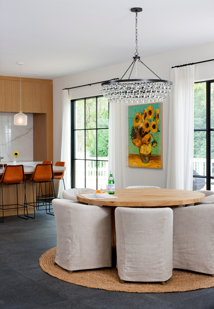 Contemporary kitchen/dining combo in DC Metro with white walls.