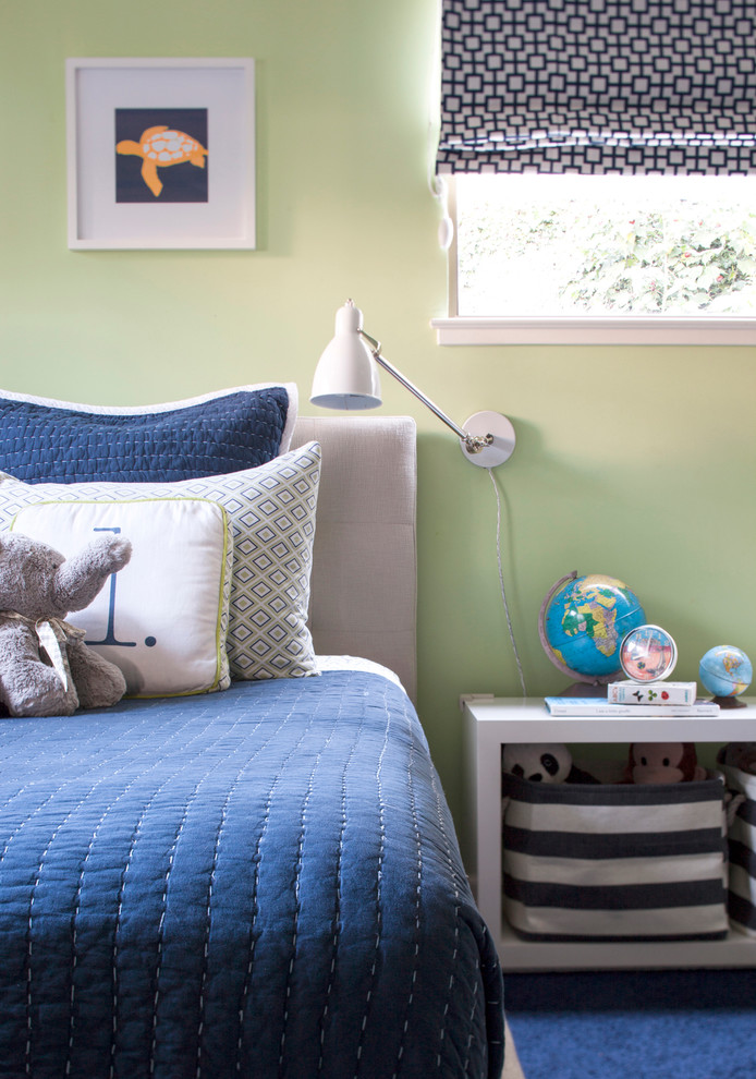 Photo of a mid-sized modern kids' bedroom for kids 4-10 years old and boys in San Francisco with green walls and medium hardwood floors.