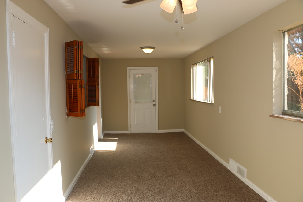 Inspiration for a mid-sized timeless open concept carpeted home design remodel with beige walls
