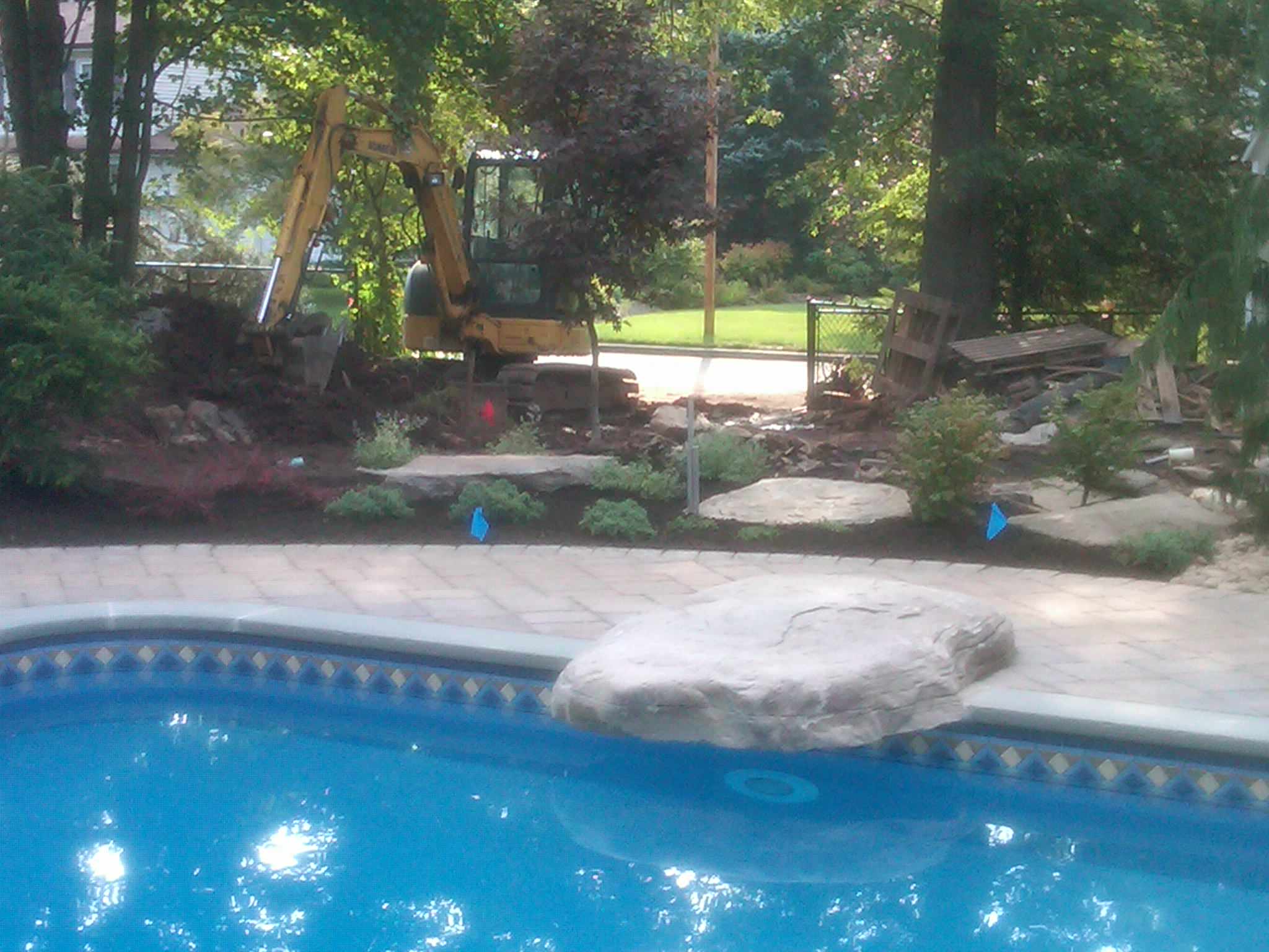 backyard landscape 'firepit''waterfall'tiered patio's pool with bluestone coping