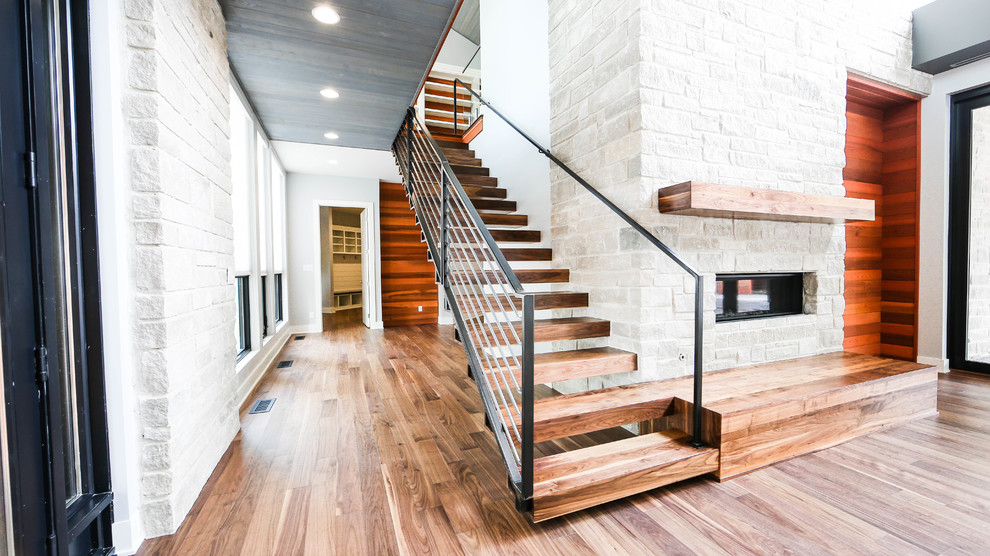 Inspiration for a mid-sized modern wood floating staircase in Indianapolis.