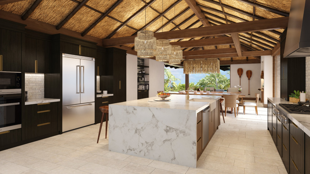 Design ideas for a large tropical open plan kitchen in Hawaii with a farmhouse sink, flat-panel cabinets, dark wood cabinets, quartz benchtops, grey splashback, glass tile splashback, stainless steel appliances, ceramic floors, with island and beige floor.