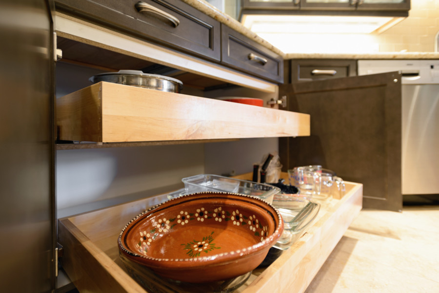 Small trendy galley travertine floor enclosed kitchen photo in Phoenix with an undermount sink, raised-panel cabinets, gray cabinets, granite countertops, beige backsplash, subway tile backsplash, stainless steel appliances and a peninsula