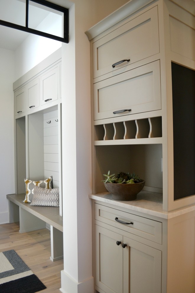 Inspiration for a mid-sized country mudroom in Indianapolis with white walls, medium hardwood floors and a double front door.