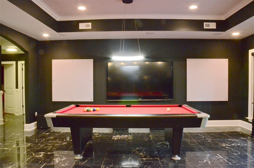 Large modern basement in Charlotte with black walls and black floor.