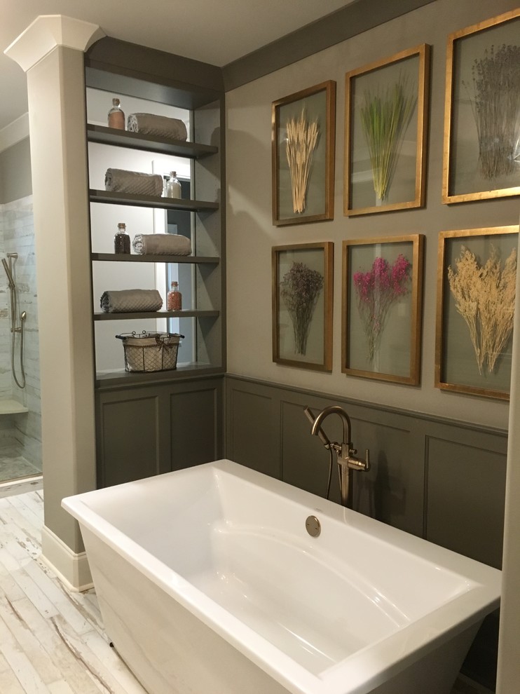 Inspiration for a mid-sized country master bathroom in Other with recessed-panel cabinets, grey cabinets, a freestanding tub, an alcove shower, white tile, porcelain tile, grey walls, painted wood floors, an undermount sink, engineered quartz benchtops, white floor and a hinged shower door.