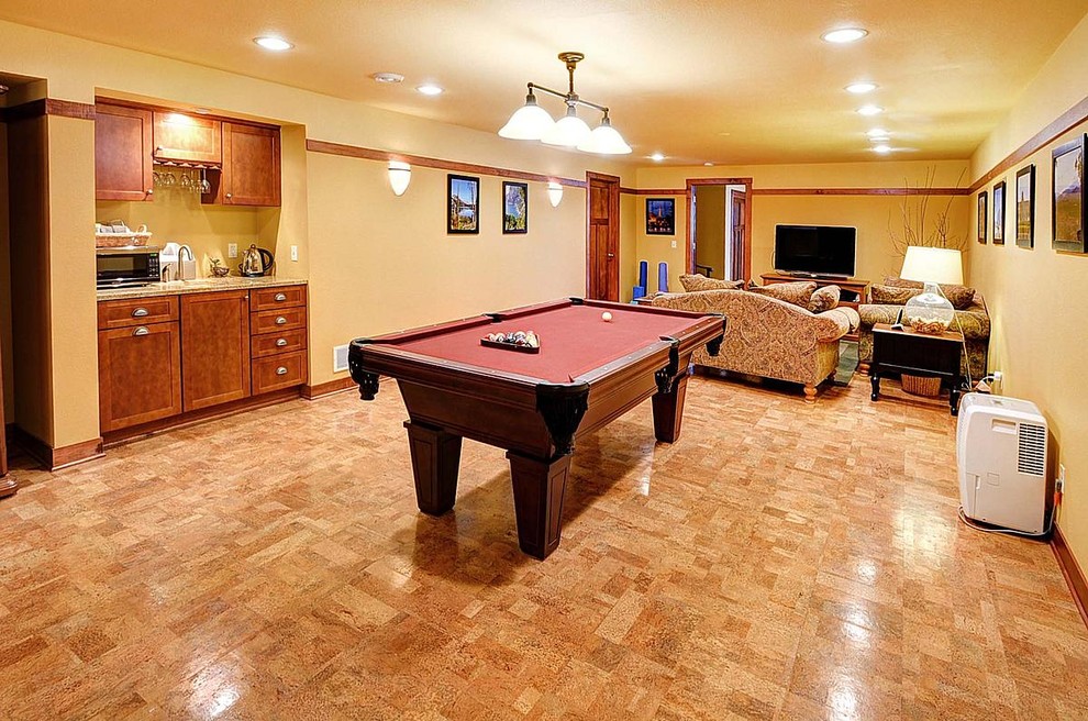 Large contemporary open concept family room in Milwaukee with a game room, yellow walls, cork floors, no fireplace and no tv.
