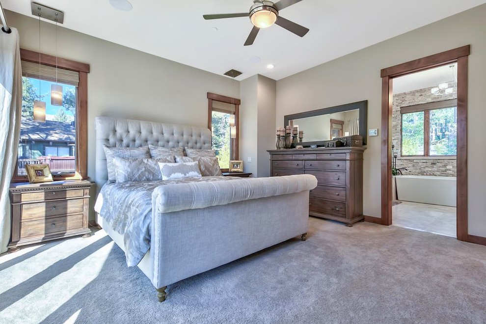 Example of a large transitional master carpeted and gray floor bedroom design with gray walls