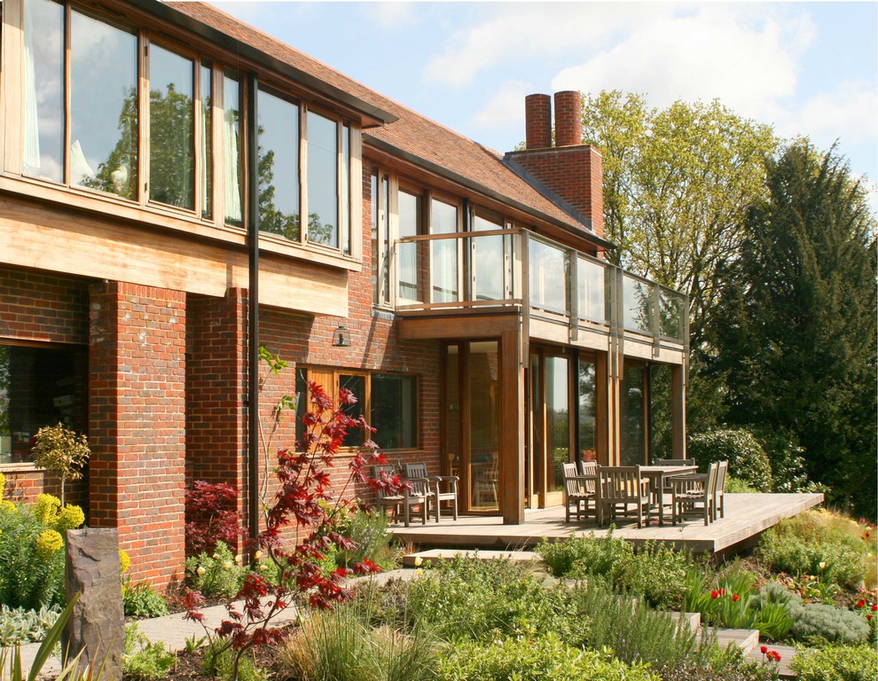 Inspiration for a two-storey brick red exterior in Hampshire.