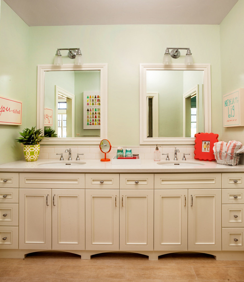 This is an example of a large transitional kids bathroom in Portland with an undermount sink, recessed-panel cabinets, beige cabinets, ceramic tile, green walls, ceramic floors, marble benchtops and white tile.