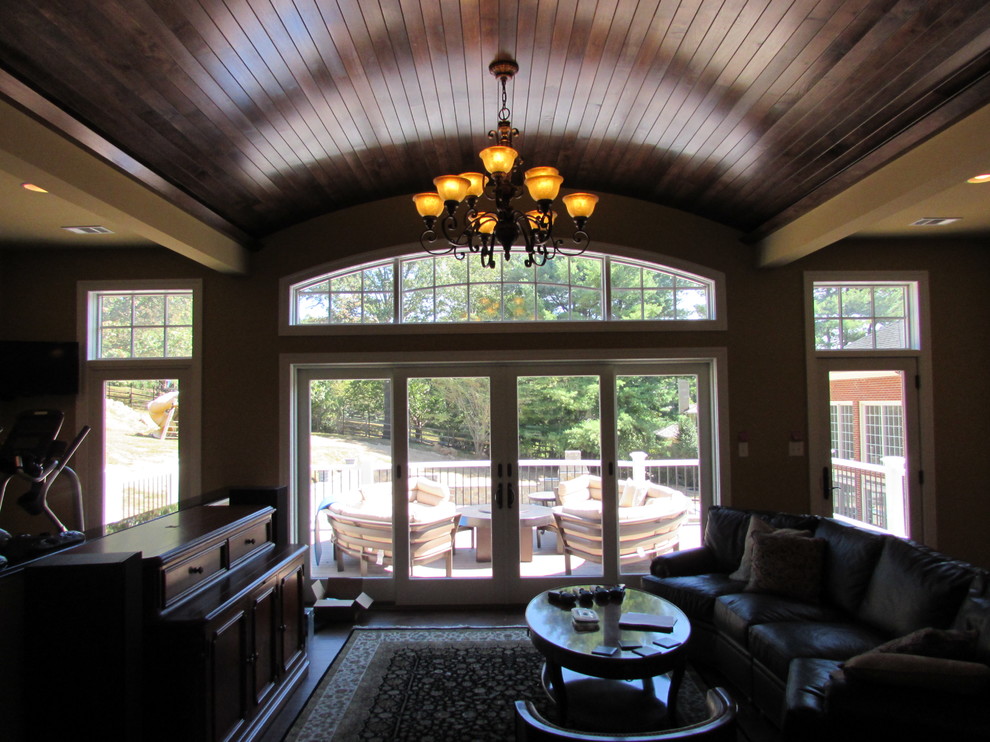 Example of a large transitional freestanding desk dark wood floor home office design in DC Metro with yellow walls